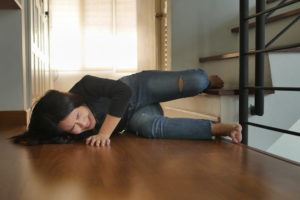 Asian woman suffering a slip and fall