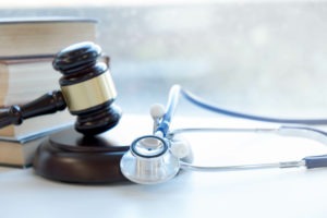 Gavel and stethoscope. How a malpractice attorney can help you if you were injured in the hands of a medical professional.