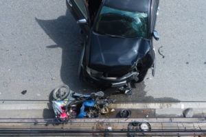 Motorcycle accident with a black car