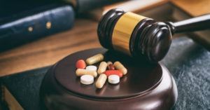 Judge's gavel and pills representing a dangerous medication lawsuit