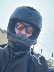 Motorcyclist with helmet following NY motorcycle equipment requirements.